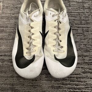 Nike black, and white track and field spikes